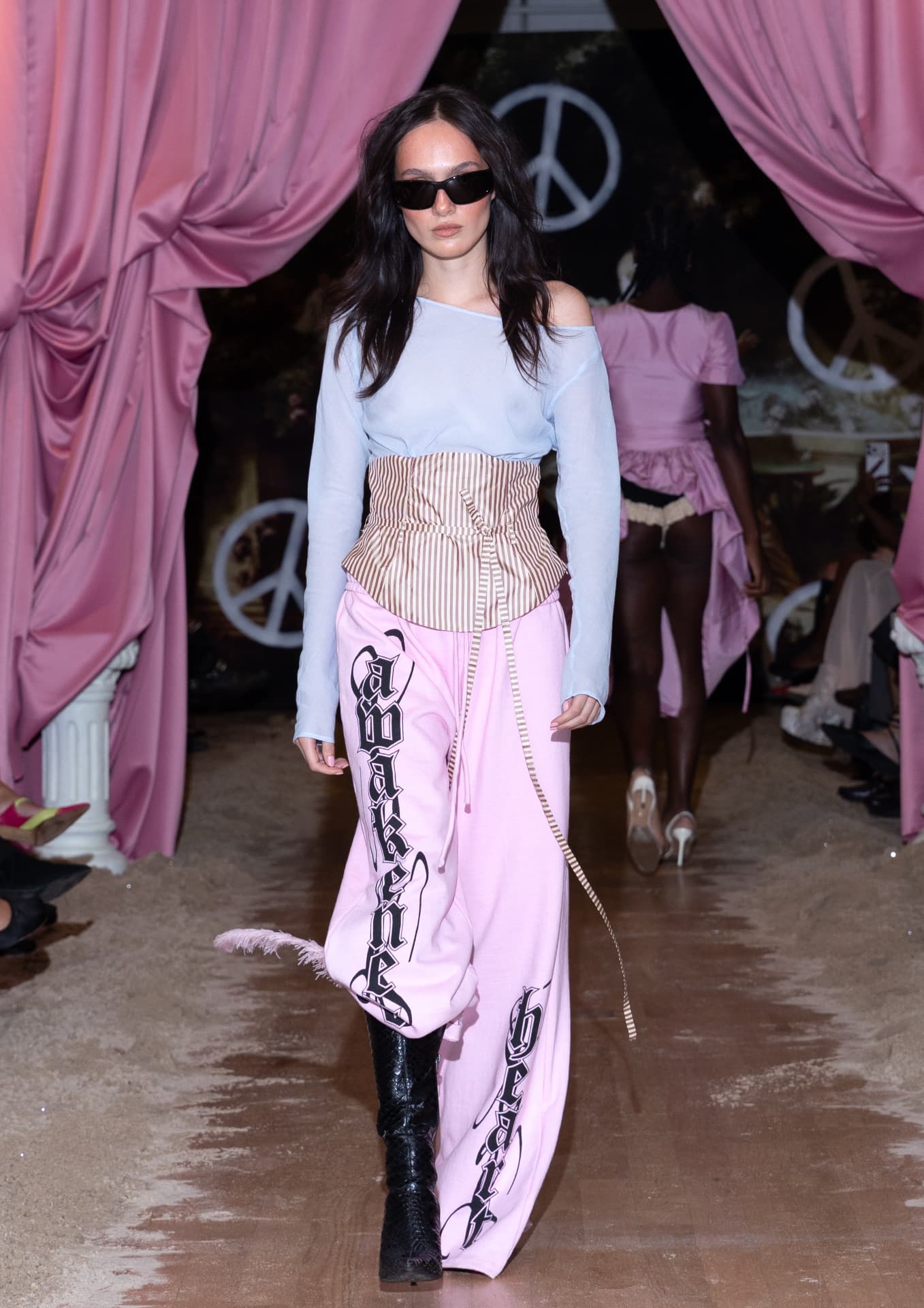 Ella Mae SS27 — sheer blue top, striped corset belt and oversized pink sweatpants