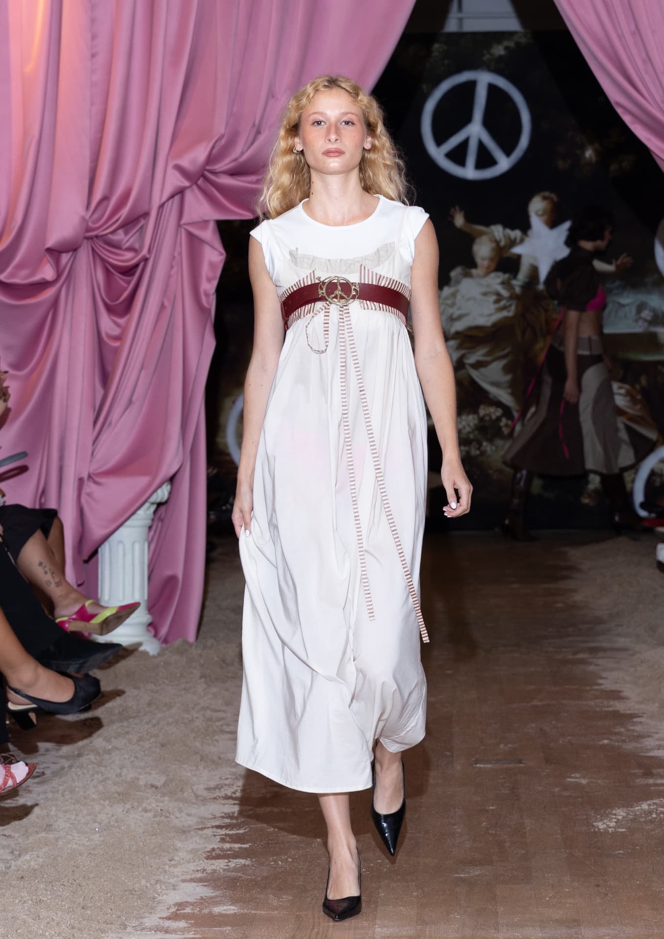 Ella Mae SS27 — white sleeveless maxi dress with a striped empire-waist belt