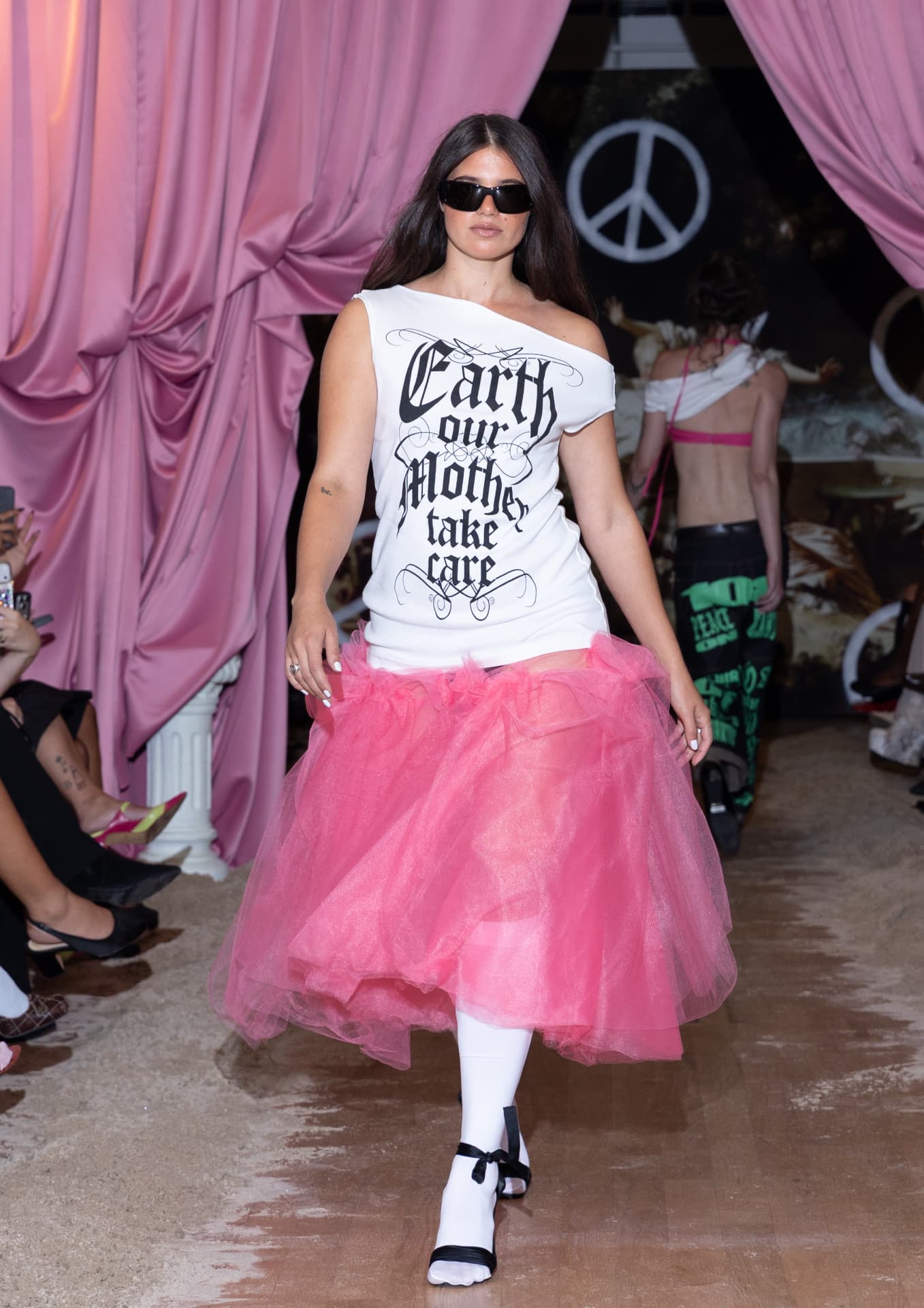 Ella Mae SS27 — white off-shoulder graphic tee with a pink tulle midi skirt