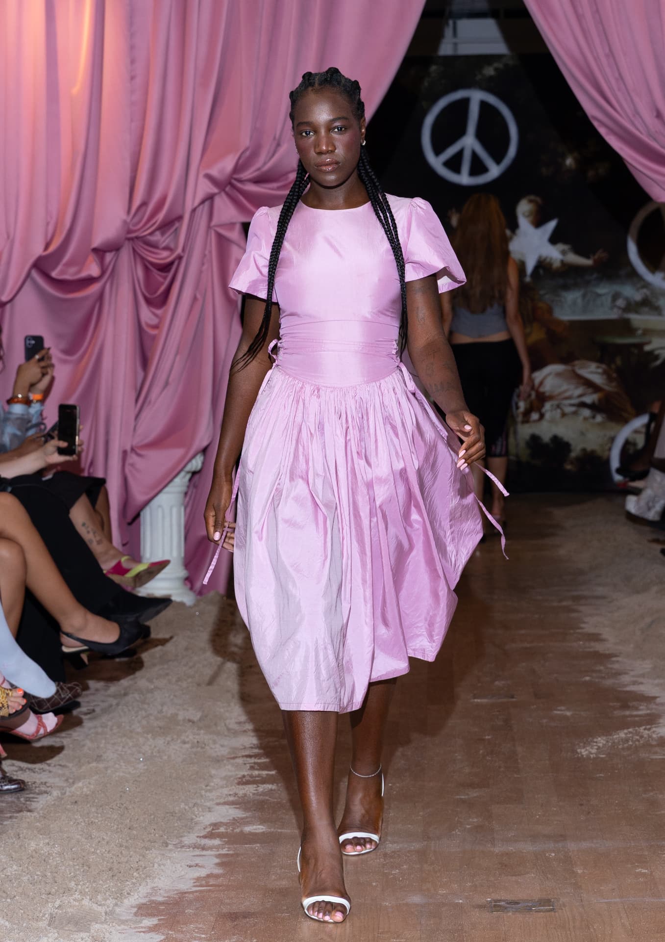 Ella Mae SS27 — shiny pink full-skirted midi dress with white sandals