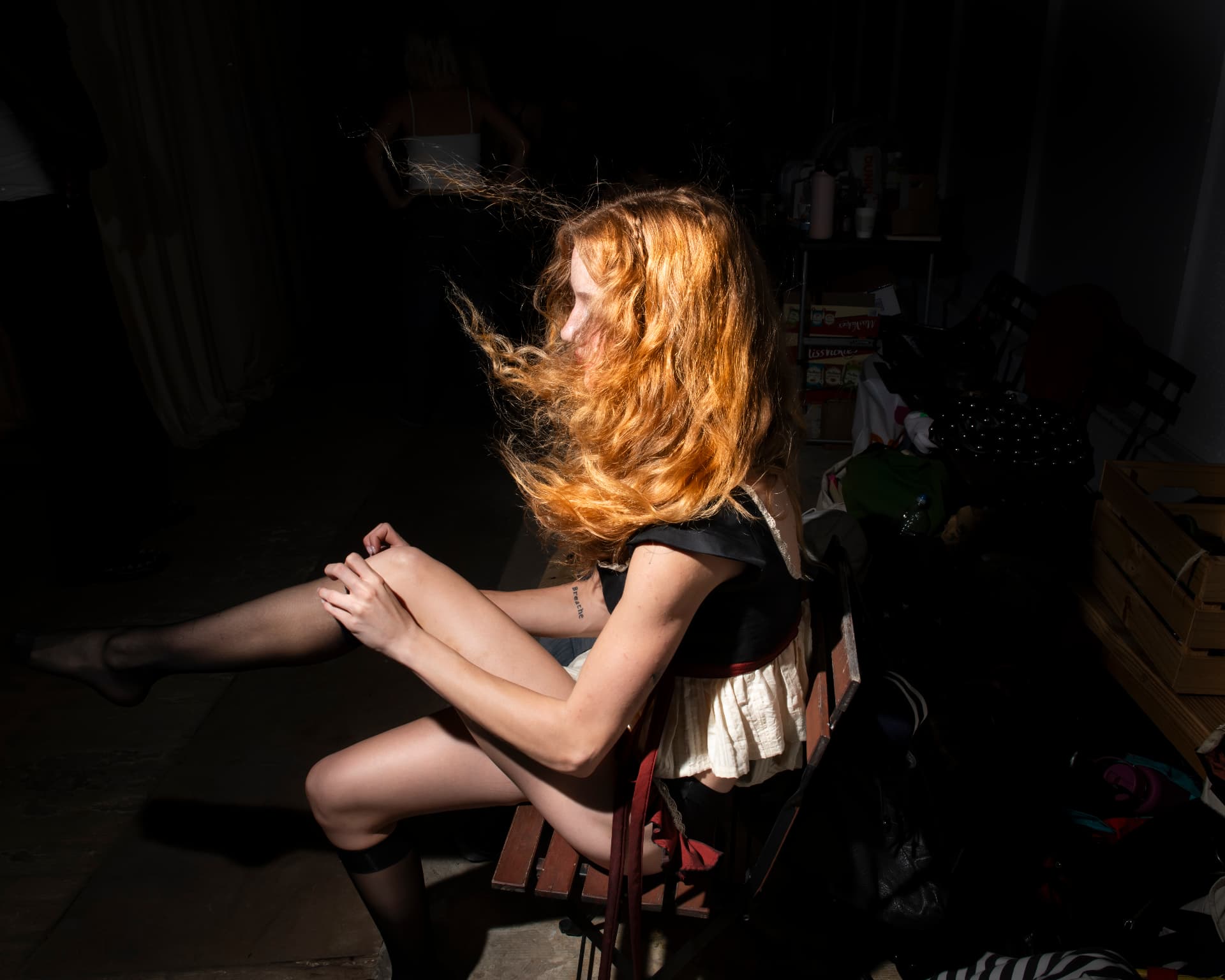 Ella Mae SS26 — model backstage in a spotlight