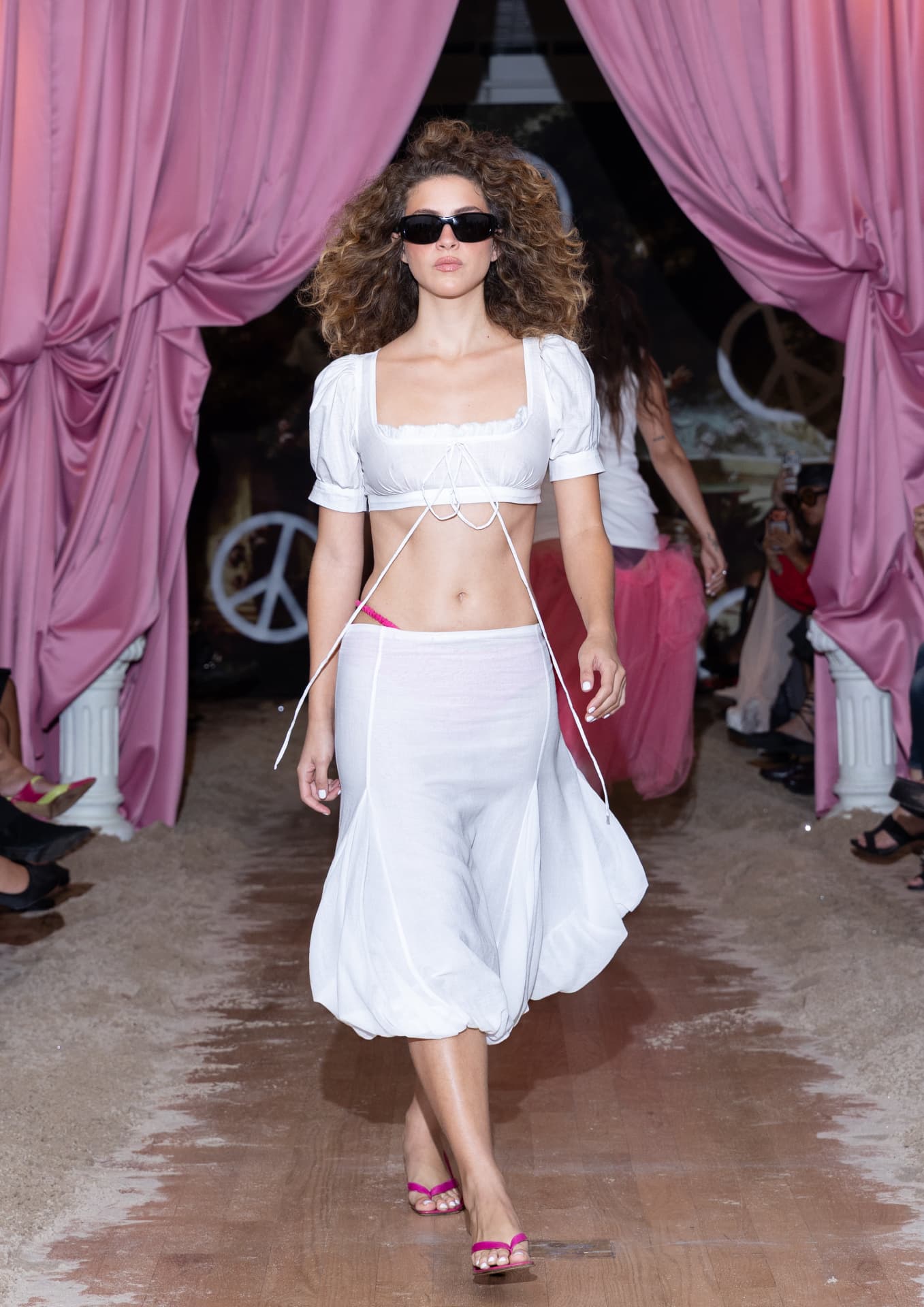 Ella Mae SS27 — white cropped lace-up two-piece with pink sandals